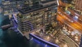 Overview to JBR and Dubai Marina skyline with modern high rise skyscrapers waterfront living apartments aerial night Royalty Free Stock Photo