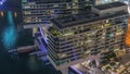 Overview to JBR and Dubai Marina skyline with modern high rise skyscrapers waterfront living apartments aerial night Royalty Free Stock Photo