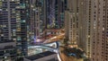 Overview to JBR and Dubai Marina skyline with modern high rise skyscrapers waterfront living apartments aerial night Royalty Free Stock Photo