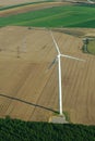 Overview of a windturbine and yellow field Royalty Free Stock Photo