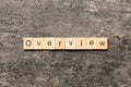 OVERVIEW word written on wood block. OVERVIEW text on cement table for your desing, concept Royalty Free Stock Photo