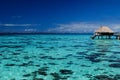 Overwater bungalow on a blue lagoon