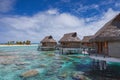 Overwater Bungalows over Coral Reef