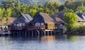 Overwater thatched roof bungalow resort Royalty Free Stock Photo