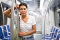 Overweary woman waiting for her stop in metropolitan train Royalty Free Stock Photo