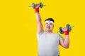 Overweight Asian men intend to exercise with lifting dumbbells to lose weight. Health care concept