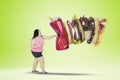 Overweight Asian woman punching unhealthy foods