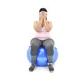 Overweight Asian woman sitting on a gym ball looking stressed covers her face with her hands isolated on white background
