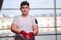 Overweight boxer wrapping his hands