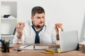 overweight businessman eating donuts Royalty Free Stock Photo