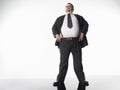 Overweight Businessman With Hands On Hips