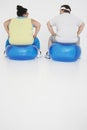 Overweight Couple Resting On Exercise Balls Royalty Free Stock Photo