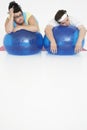 Overweight Couple Resting On Exercise Balls Royalty Free Stock Photo