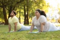 Overweight couple training together in park