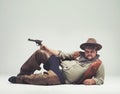 Ill make you burn some calories... Overtime. An overweight cowboy giving you a come hither look while isolated on gray. Royalty Free Stock Photo