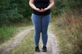 Overweight fat woman with little apple Royalty Free Stock Photo