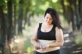 Overweight fat woman taking slimming pills. Weight loosing, diet Royalty Free Stock Photo