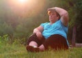 Overweight hiker woman relaxing.