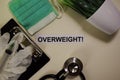Overweight with inspiration and healthcare/medical concept on desk background