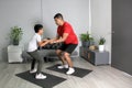 Overweight Latino dad and son exercise at home to lose weight and be healthy to avoid diseases such as diabetes or hypertension