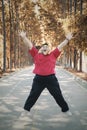 Overweight man exercising and jumping at park Royalty Free Stock Photo