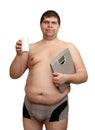 Overweight man with medicaments and scales