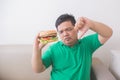 Overweight man stop eating junk food Royalty Free Stock Photo