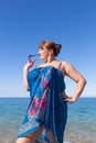Overweight middle aged woman at the sea Royalty Free Stock Photo
