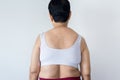 Overweight senior woman pinching her fat body,Cellulite,squeezing her belly fat around her back,Healthy lifestyle concept Royalty Free Stock Photo