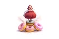 Overweight and sweets. Harm of sweets and pastries. bbw figurine on donuts .Emotional overweight woman and appetizing