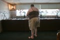 Overweight woman eats at buffet in Eastern Shore, Maryland