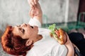 Overweight woman eats sandwich, bulimic, obesity Royalty Free Stock Photo