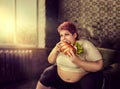 Overweight woman eats sandwich, bulimic Royalty Free Stock Photo