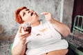 Overweight woman eats sweet cake, obesity