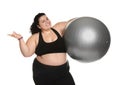 Overweight woman with fit ball on white Royalty Free Stock Photo