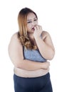 Overweight woman looks confused Royalty Free Stock Photo