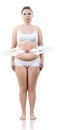 Overweight woman measuring her fat belly. Royalty Free Stock Photo