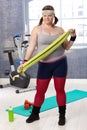 Overweight woman prepared for workout at the gym