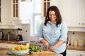 Overweight Woman Preparing Vegetables in Kitchen Royalty Free Stock Photo