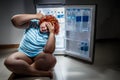 Overweight woman with refregerator Royalty Free Stock Photo