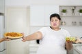 Overweight woman refusing to eat pizza Royalty Free Stock Photo