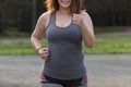 Overweight woman running. Weight loss concept.