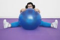 Overweight Woman Sitting Behind Exercise Ball Royalty Free Stock Photo