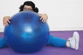 Overweight Woman Sitting Behind Exercise Ball Royalty Free Stock Photo