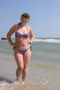 Overweight woman in a swimsuit Royalty Free Stock Photo