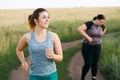 Overweight woman take breath at jogging workout