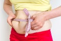 Overweight woman with tape measure - obesity concept Royalty Free Stock Photo