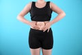 Overweight woman touching belly fat before weight loss Royalty Free Stock Photo