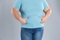 Overweight woman touching belly fat before weight loss Royalty Free Stock Photo