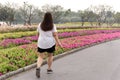 Overweight woman walking in the park